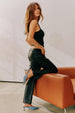 caption_Model wears Black Vegan Leather Trousers in UK 10 / US 6