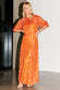 Model wearing Orange Jacquard Bibi Dress