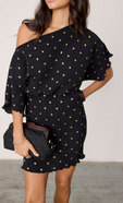 model wears our black plisse tilly mini dress with gold fleck