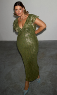 model is wearing the olive and gold jacquard tilda dress