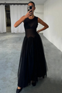 model is taking selfie wearing the black monika dress