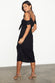 caption_Model wears Black Cassie Dress in UK size 10/ US 6