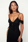 caption_Model wears Black Cassie Dress in UK size 10/ US 6
