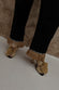  caption_Model wears  Black Raffia Marra Trousers in UK size 8/ US 4
