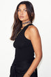 caption_Model wears Black Cotton Ribbed Tank  in UK size 10/ US 6