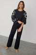 caption_Model wears Black Enchanted Lillie Top in UK size 8/ US 4