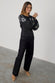 caption_Model wears Black Enchanted Lillie Top in UK size 8/ US 4