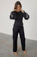 caption_Model wears Black Enchanted Lillie Top in UK size 8/ US 4
