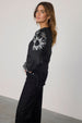 caption_Model wears Black Enchanted Lillie Top in UK size 8/ US 4