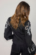 caption_Model wears Black Enchanted Lillie Top in UK size 8/ US 4