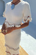 caption_Model wears Ivory and Red Harper Dress in size S