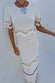 caption_Model wears Ivory and Red Harper Dress in size S