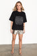 caption_Model wears Silver Vegan Leather Shorts in UK size 10/ US 6