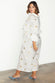 caption_Model wears  Gold Snake Jaspre Wrap Skirt in UK size 18 / US 14