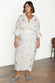 caption_Model wears  Gold Snake Jaspre Wrap Skirt in UK size 18 / US 14