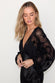 caption_Model wears Black Swallow Romance Emma Dress in UK size 10/ US 6