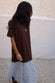 caption_Model wears Chocolate Cara T Shirt Dress  in size M