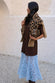 caption_Model wears Chocolate Cara T Shirt Dress  in size M