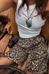 caption_Model wears Leopard Lucia Scallop Pocket Long Shorts in UK size 10/ US 6