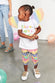 Model wearing Love Love Love T-Shirt standing facing the camera